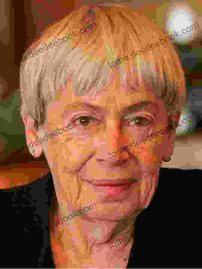 A Headshot Of Lavinia Ursula Le Guin, A Woman With Short Gray Hair And Piercing Blue Eyes, Wearing A Black Turtleneck Sweater. Lavinia Ursula K Le Guin