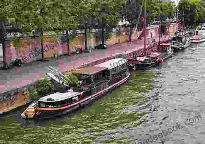 A Photograph Of A Houseboat Moored Along The River Seine In Paris, Surrounded By Lush Greenery And Buildings On The Opposite Bank. Houseboat On The Seine: A Memoir