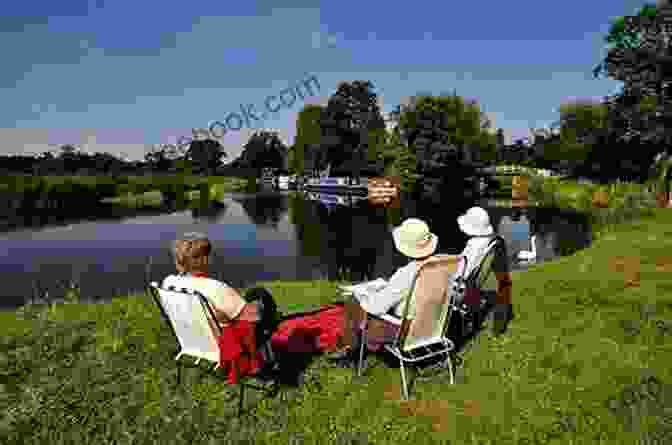 Cyclists Enjoying A Picnic By A River Cycle Touring In Wales: A Two Week Circuit And Shorter Tours (Cicerone Cycling Guides)