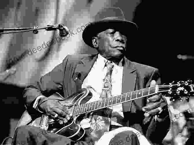 John Lee Hooker Performing On Stage, With A Guitar Hanging Around His Neck John Lee Hooker Anthology Songbook